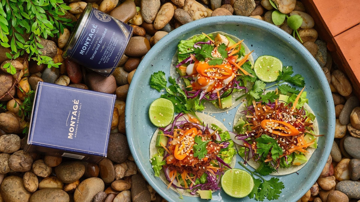 Homemade street tacos plated next to a tin of Montagé Mandalay tamarind smoked sea salt