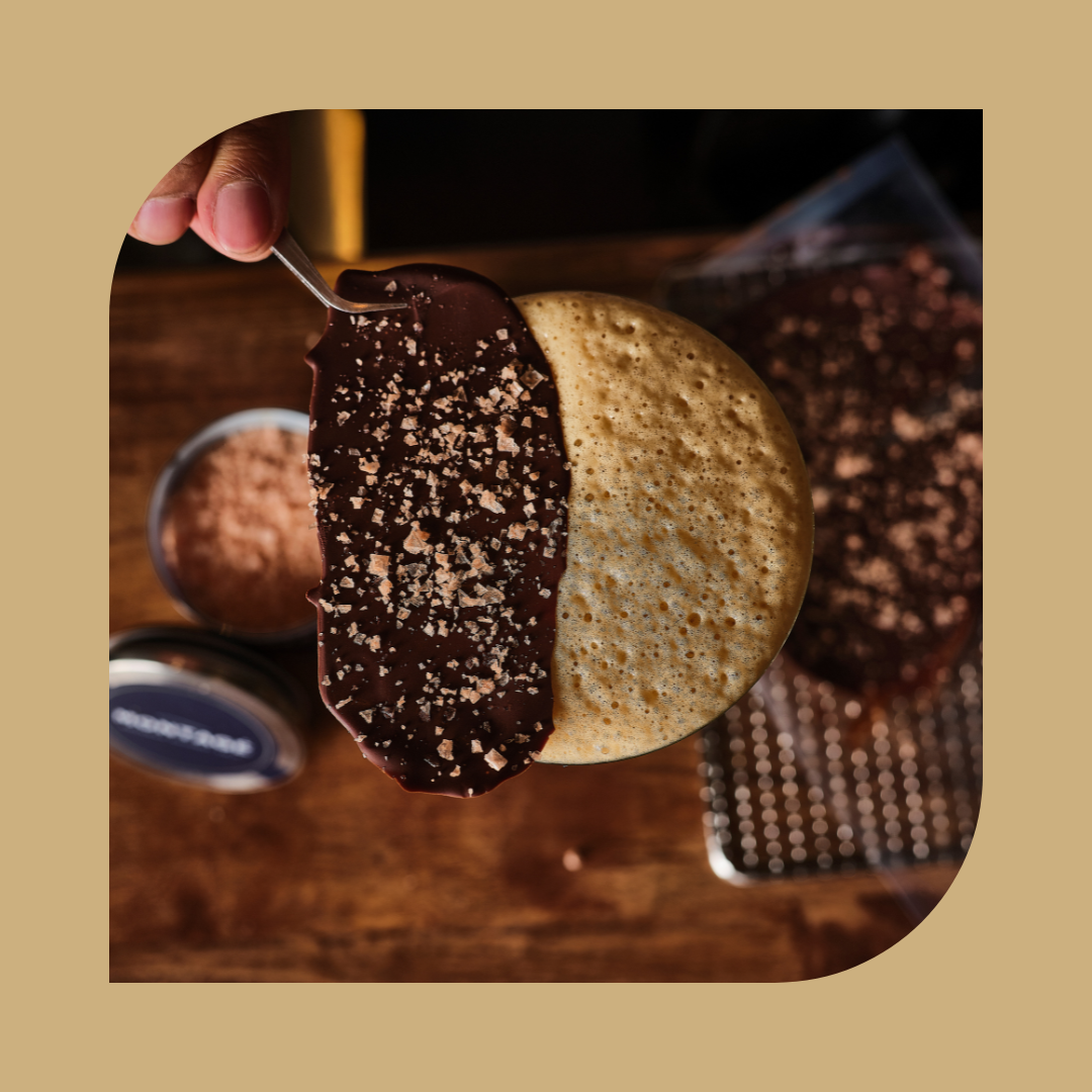 Close up of flaky himalayan salt on chocolate 