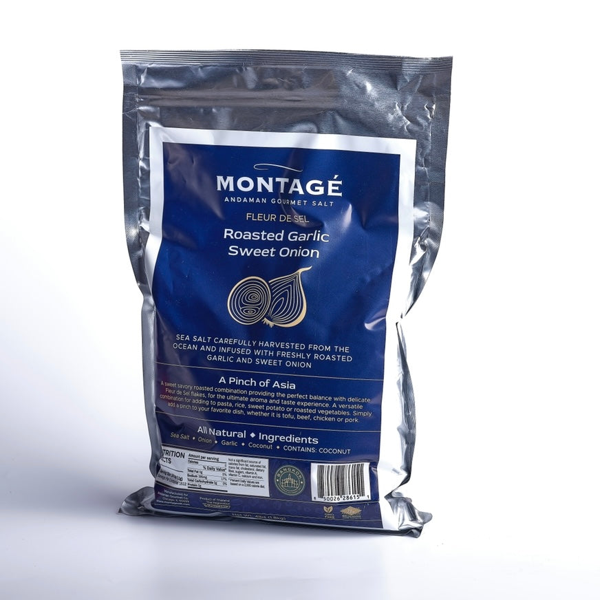 A blue aluminum foil bag of Montagé Roasted Garlic Sweet Onion flavored salt, with product details and branding visible.