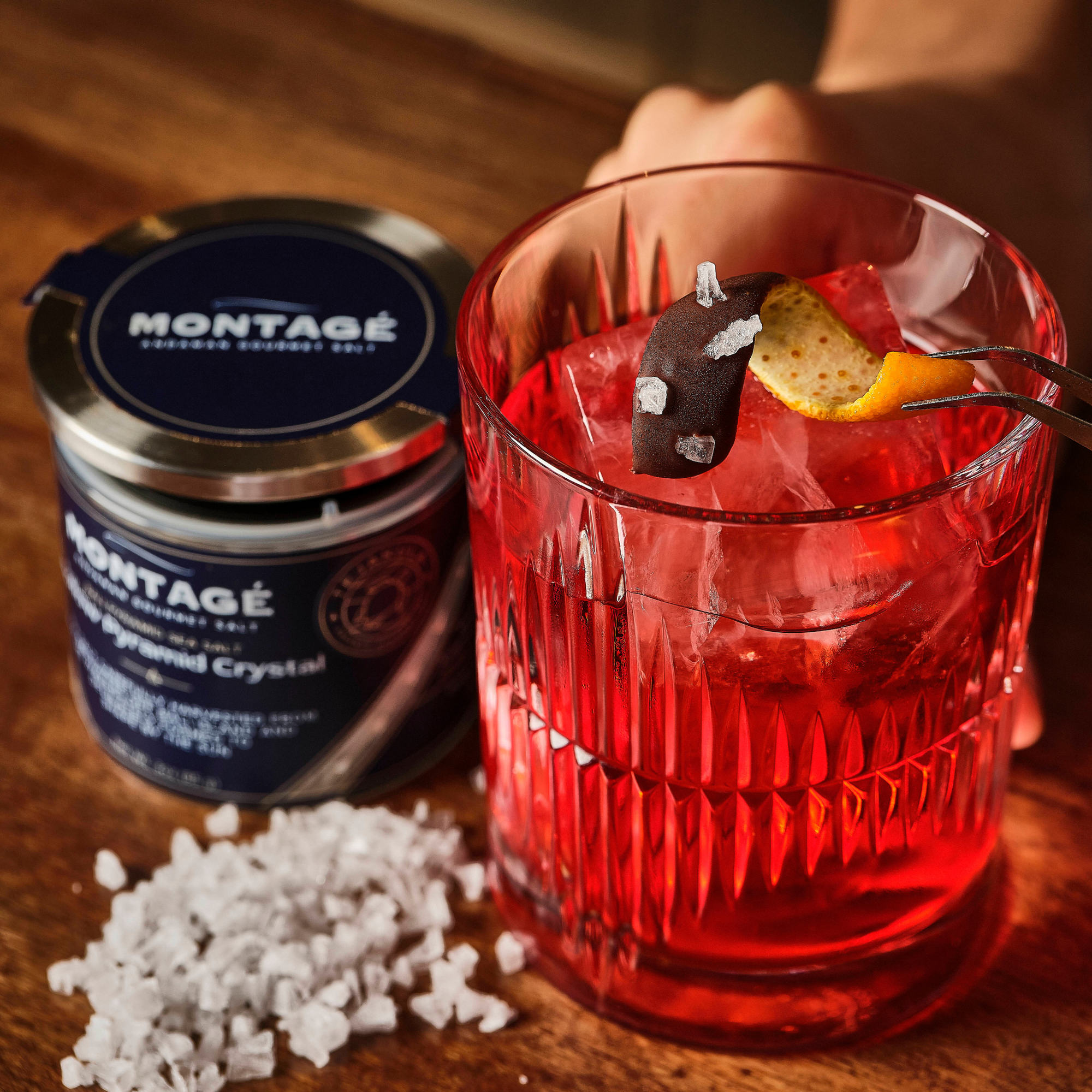 negroni cockail with orange chocolate and coarse sea salt garnish