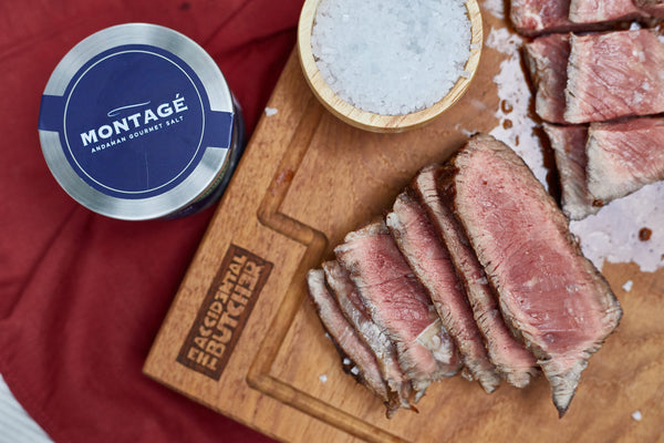 Close-up of pan-seared steak slices seasoned with Montagé Kusamba pyramid sea salt