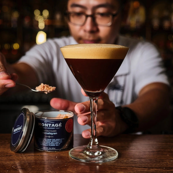 Spoonful of Montagé Himalayan pink salt flakes held over an espresso martini