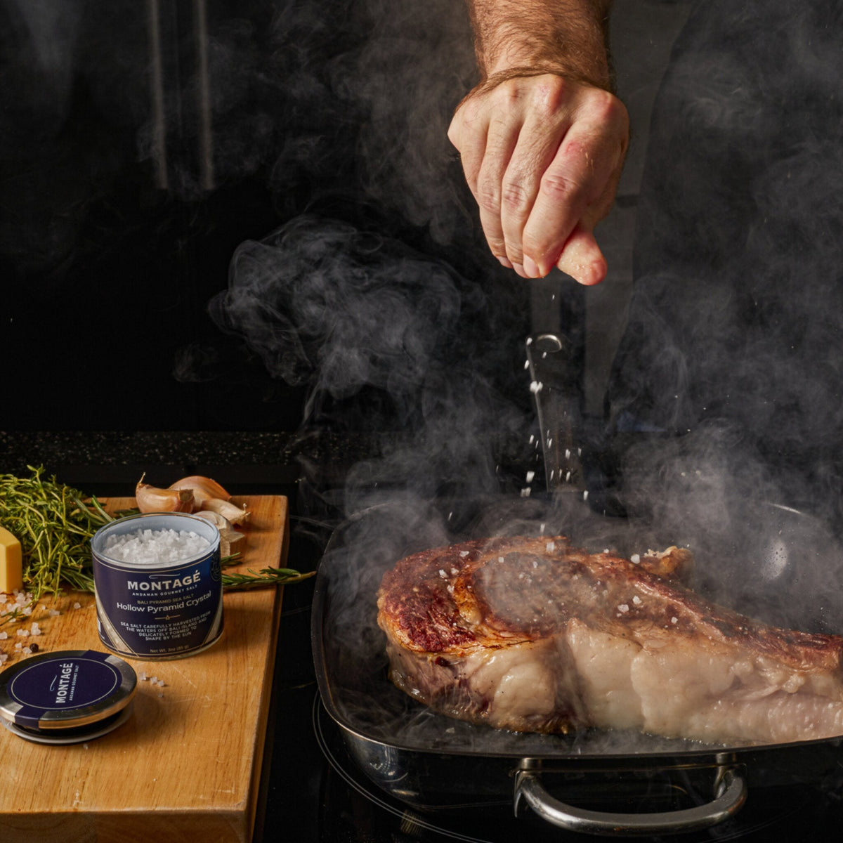 Finishing a pan-seared steak with a pinch of Montagé Tejakula hollow pyramid salt