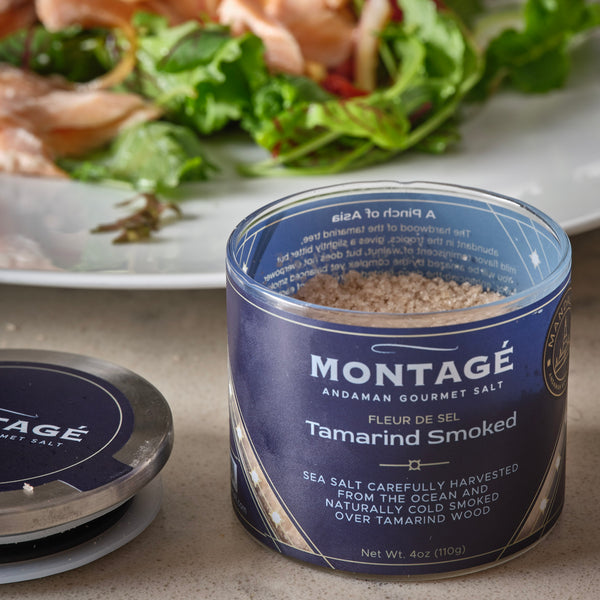 Smoked Gourmet Salt | Tamarind Smoked | 4oz Glass Jar opened with salad in the background